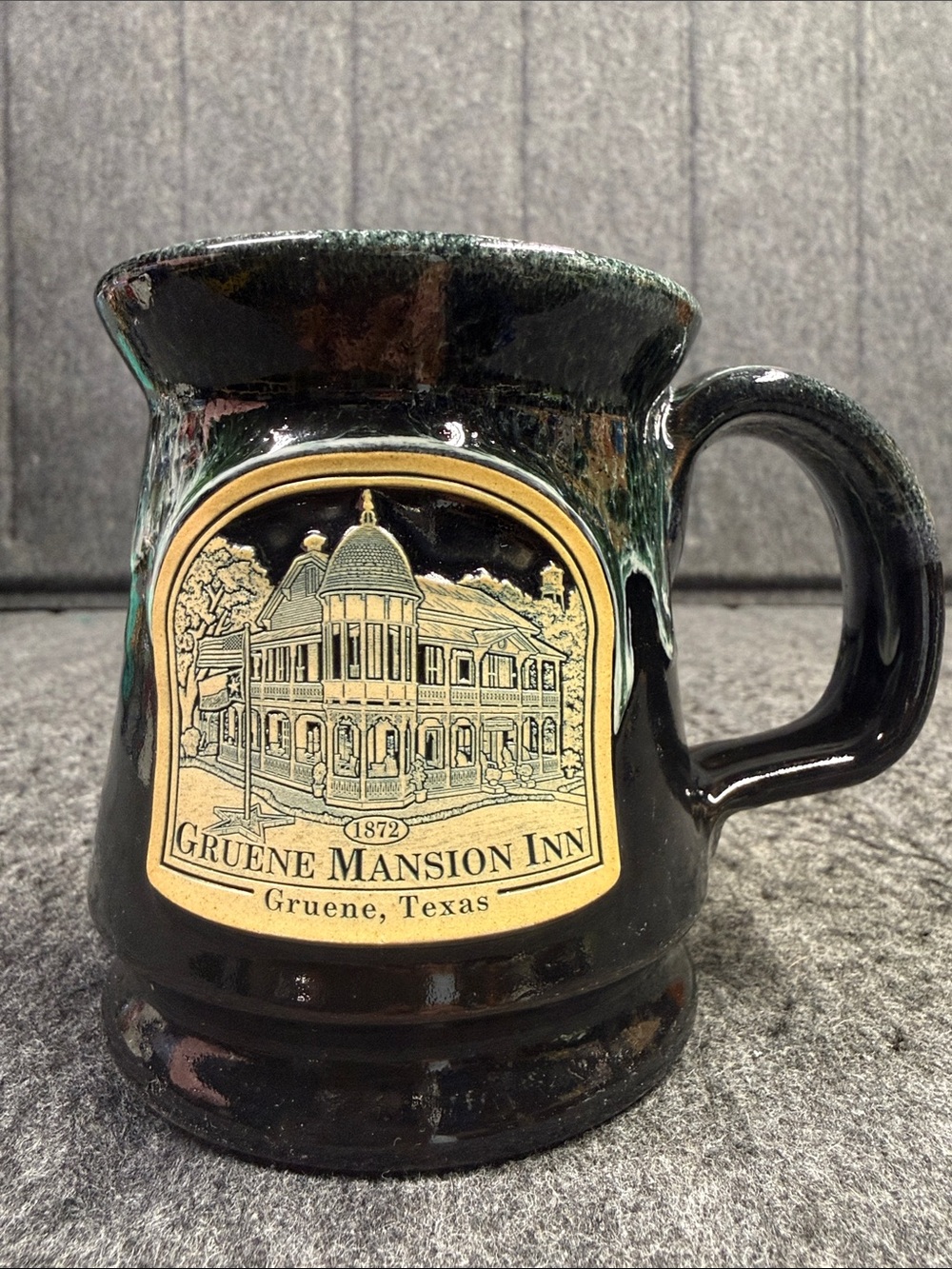 Gruene Mansion Inn Black Ceramic Mug with Gold Emblem Detail